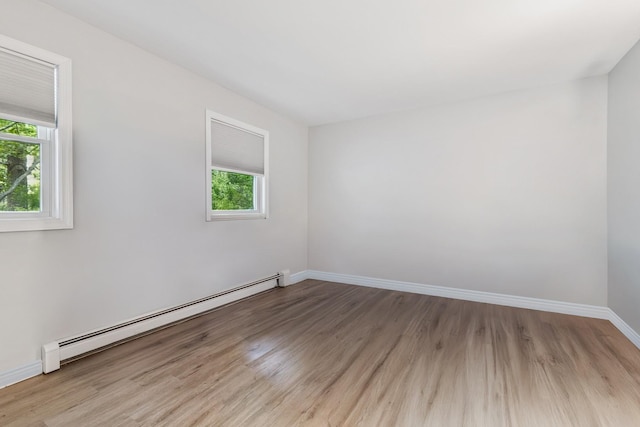 185 Carlton Dr E, Shirley, NY 11967 - unfurnished room featuring a baseboard radiator and light wood finished floors