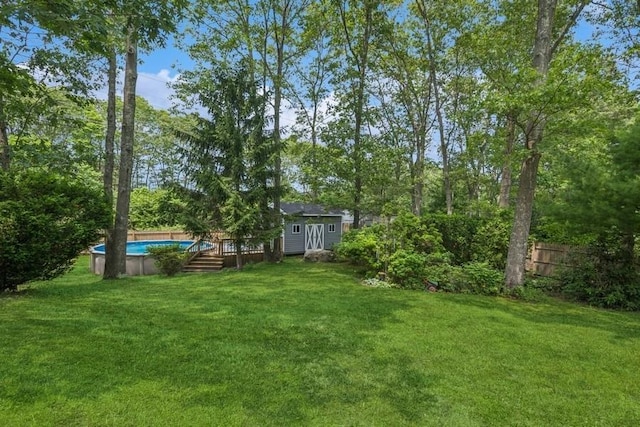 185 Carlton Dr E, Shirley, NY 11967 - view of yard featuring an outdoor pool and an outdoor structure