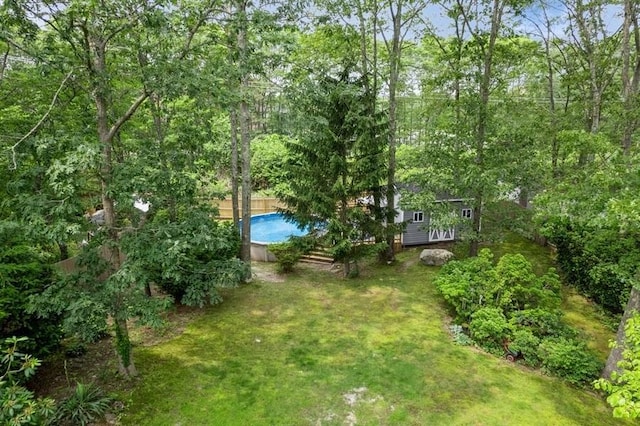 185 Carlton Dr E, Shirley, NY 11967 - view of green lawn featuring an outdoor pool and an outdoor structure