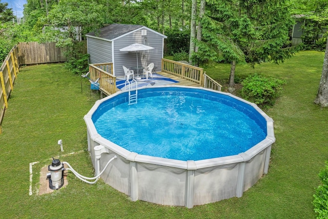 185 Carlton Dr E, Shirley, NY 11967 - view of swimming pool with a deck and an outbuilding