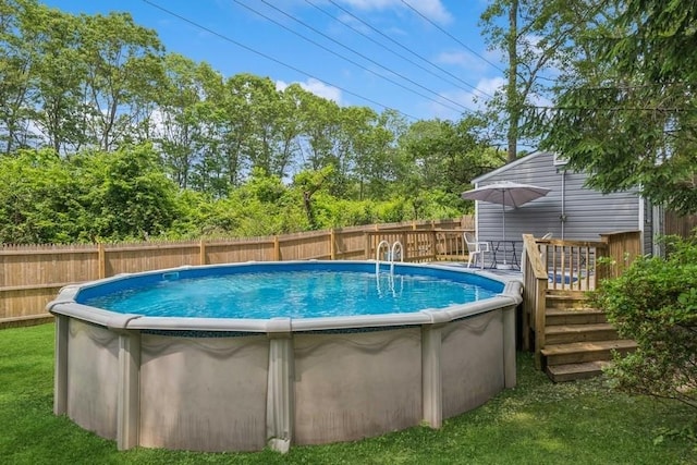 185 Carlton Dr E, Shirley, NY 11967 - view of pool with a wooden deck and view of wooded area