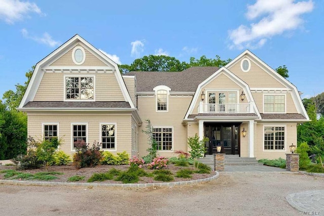 19 Meadow Glen Rd, Fort Salonga, NY 11768 - view of front of property featuring a gambrel roof, a balcony, and a shingled roof