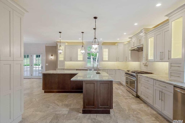 19 Meadow Glen Rd, Fort Salonga, NY 11768 - kitchen with appliances with stainless steel finishes, a center island, decorative backsplash, recessed lighting, and light stone counters