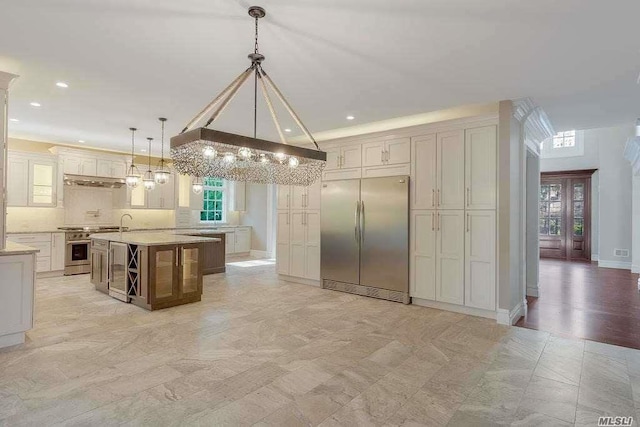 19 Meadow Glen Rd, Fort Salonga, NY 11768 - kitchen with stainless steel appliances, a chandelier, hanging light fixtures, recessed lighting, and backsplash
