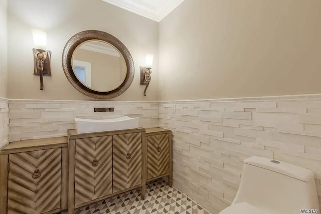 19 Meadow Glen Rd, Fort Salonga, NY 11768 - bathroom featuring tile walls, ornamental molding, vanity, and wainscoting