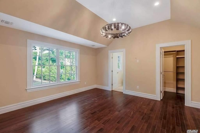 19 Meadow Glen Rd, Fort Salonga, NY 11768 - unfurnished living room featuring lofted ceiling, dark wood finished floors, and a chandelier