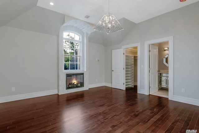 19 Meadow Glen Rd, Fort Salonga, NY 11768 - unfurnished living room with a chandelier, vaulted ceiling, wood finished floors, a glass covered fireplace, and stairway