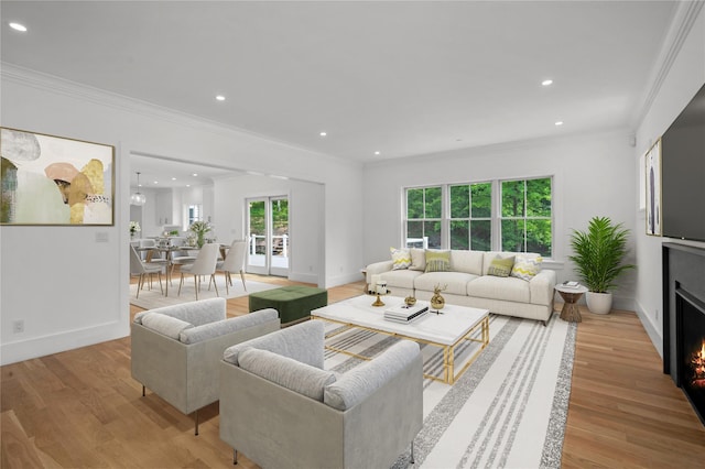 63 Buckout Rd, West Harrison, NY 10604 - living area featuring crown molding, recessed lighting, light wood finished floors, and a lit fireplace