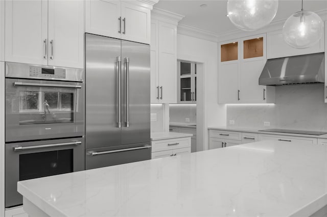 63 Buckout Rd, West Harrison, NY 10604 - kitchen featuring stainless steel appliances, range hood, white cabinets, glass insert cabinets, and crown molding