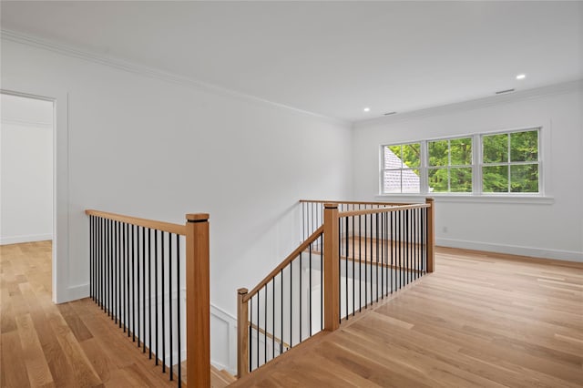 63 Buckout Rd, West Harrison, NY 10604 - stairs with wood finished floors, crown molding, and recessed lighting