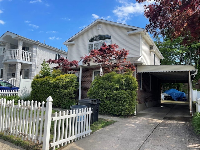 24580 61st Ave Unit 68Th, Little Neck, NY 11362 - view of front of property with concrete driveway, brick siding, and an attached carport