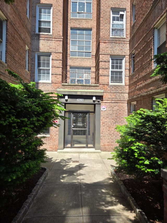 6393 Woodhaven Blvd Unit 2F, Rego Park, NY 11374 - doorway to property with brick siding