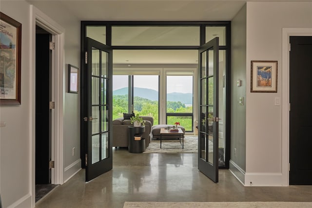 20 Paye Ave, Beacon, NY 12508 - doorway to outside with french doors, concrete floors, and a mountain view