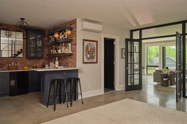 20 Paye Ave, Beacon, NY 12508 - indoor wet bar with finished concrete floors, a wall mounted AC, and black dishwasher