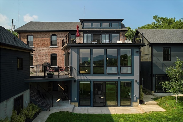 20 Paye Ave, Beacon, NY 12508 - back of property with a balcony, a patio area, stairs, and brick siding