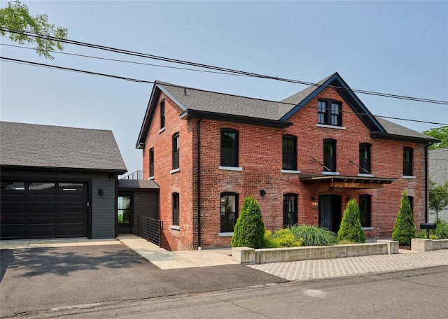 20 Paye Ave, Beacon, NY 12508 - view of front of house featuring brick siding, driveway, a garage, and roof with shingles