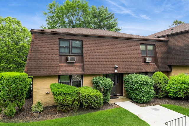 1 Germonds Vlg Unit 16, Bardonia, NY 10954 - view of front facade featuring brick siding, roof with shingles, and cooling unit