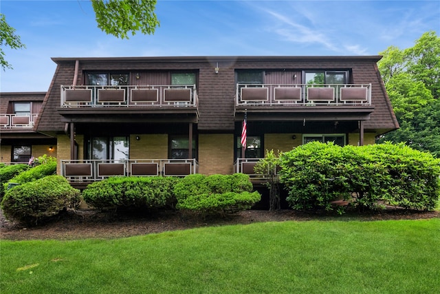 1 Germonds Vlg Unit 16, Bardonia, NY 10954 - back of property with a balcony, brick siding, a lawn, and mansard roof