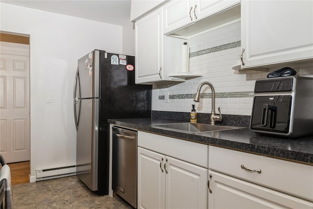1 Germonds Vlg Unit 16, Bardonia, NY 10954 - kitchen with baseboard heating, decorative backsplash, white cabinetry, and dishwasher