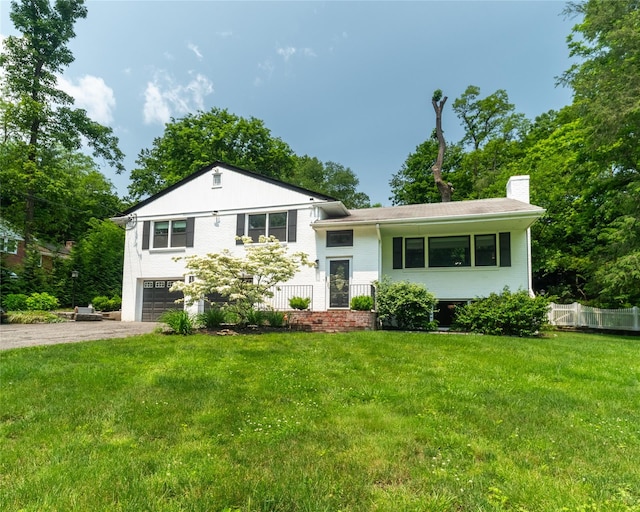 175 Chappaqua Rd, Briarcliff Manor, NY 10562 - split level home featuring asphalt driveway, an attached garage, a chimney, and brick siding