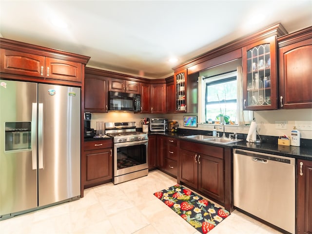 175 Chappaqua Rd, Briarcliff Manor, NY 10562 - kitchen with appliances with stainless steel finishes, dark countertops, and glass insert cabinets
