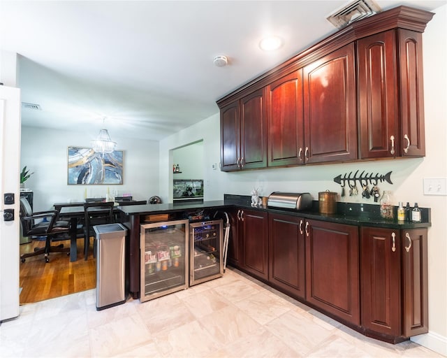 175 Chappaqua Rd, Briarcliff Manor, NY 10562 - kitchen featuring wine cooler, a peninsula, and hanging light fixtures