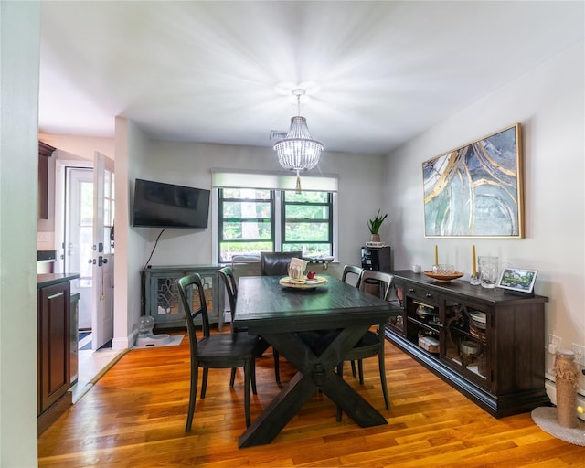175 Chappaqua Rd, Briarcliff Manor, NY 10562 - dining room featuring a chandelier and light wood finished floors