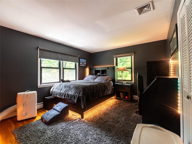 175 Chappaqua Rd, Briarcliff Manor, NY 10562 - bedroom featuring wood finished floors and a baseboard radiator