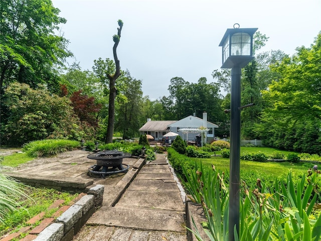 175 Chappaqua Rd, Briarcliff Manor, NY 10562 - view of patio with a fire pit and view of wooded area