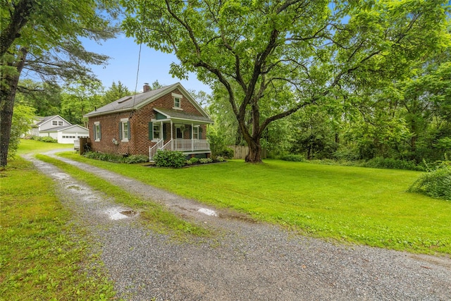 342-344 Van Wagner Rd, Poughkeepsie, NY 12603 - view of front of property with covered porch, brick siding, a front yard, a chimney, and driveway