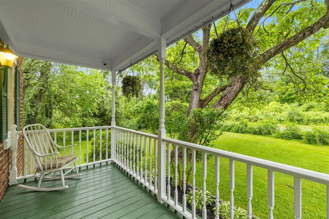 342-344 Van Wagner Rd, Poughkeepsie, NY 12603 - wooden deck with a lawn and view of scattered trees