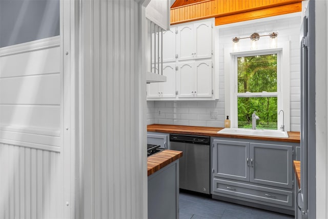 342-344 Van Wagner Rd, Poughkeepsie, NY 12603 - kitchen with butcher block countertops, stainless steel dishwasher, gray cabinets, white cabinetry, and backsplash