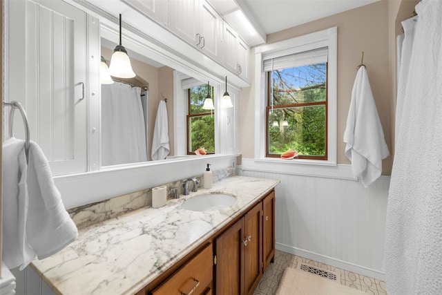 342-344 Van Wagner Rd, Poughkeepsie, NY 12603 - full bathroom featuring vanity and wainscoting