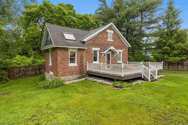 342-344 Van Wagner Rd, Poughkeepsie, NY 12603 - view of front of house featuring brick siding, a wooden deck, a fenced backyard, a chimney, and roof with shingles