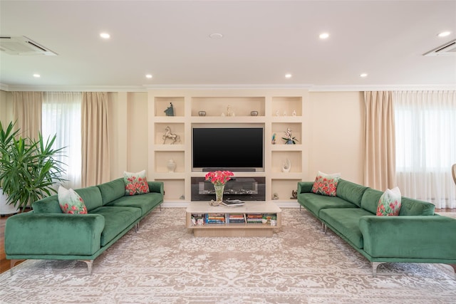 79 Fern St, New Rochelle, NY 10801 - living room featuring crown molding, recessed lighting, and built in shelves