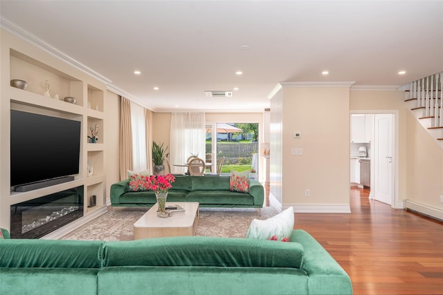79 Fern St, New Rochelle, NY 10801 - living room with wood finished floors, stairs, ornamental molding, recessed lighting, and baseboard heating