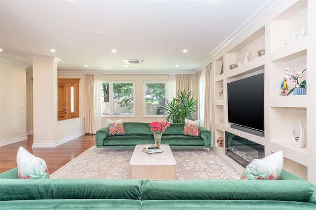 79 Fern St, New Rochelle, NY 10801 - living room with wood finished floors, crown molding, built in features, and recessed lighting
