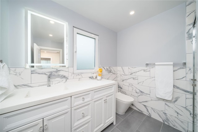 79 Fern St, New Rochelle, NY 10801 - bathroom featuring tile walls, vanity, recessed lighting, tile patterned floors, and a wainscoted wall