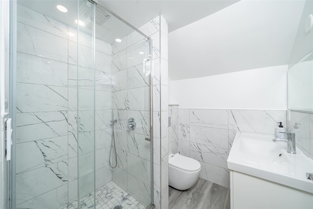 79 Fern St, New Rochelle, NY 10801 - full bath with vanity, a shower stall, tile walls, wood finished floors, and wainscoting