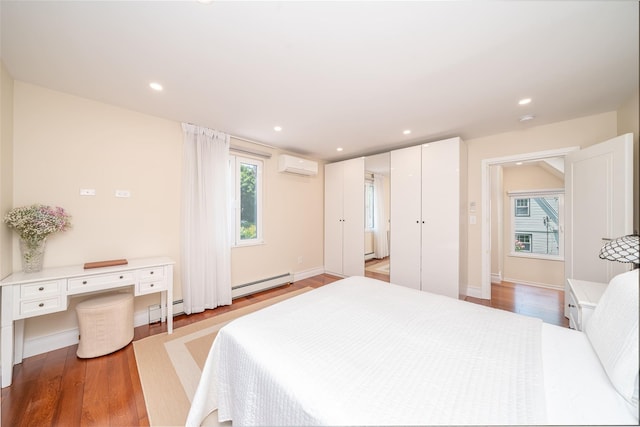 79 Fern St, New Rochelle, NY 10801 - bedroom with a wall mounted air conditioner, a baseboard radiator, light wood finished floors, and recessed lighting