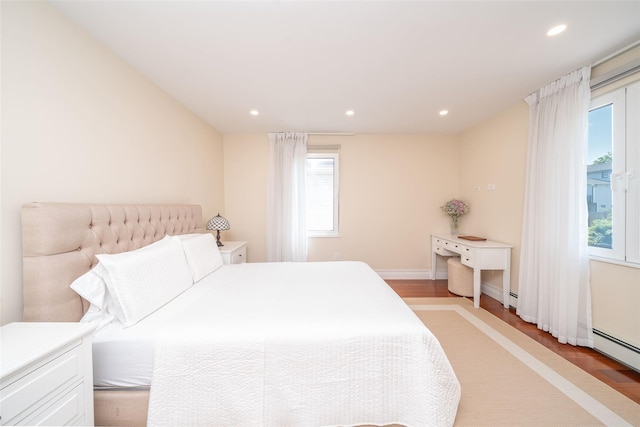 79 Fern St, New Rochelle, NY 10801 - bedroom featuring light wood-style floors, recessed lighting, and a baseboard heating unit