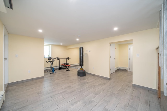 79 Fern St, New Rochelle, NY 10801 - exercise room featuring light wood-style flooring, recessed lighting, and a baseboard heating unit