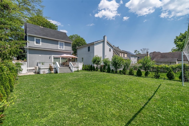 79 Fern St, New Rochelle, NY 10801 - back of property with a deck, stucco siding, and a residential view