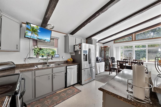 11 Beverly Ln, Peekskill, NY 10566 - kitchen with stainless steel appliances, dark countertops, and plenty of natural light