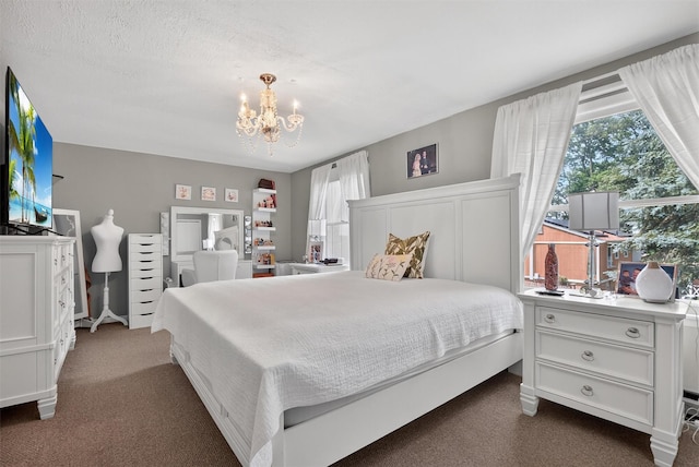 11 Beverly Ln, Peekskill, NY 10566 - bedroom with a chandelier and dark carpet