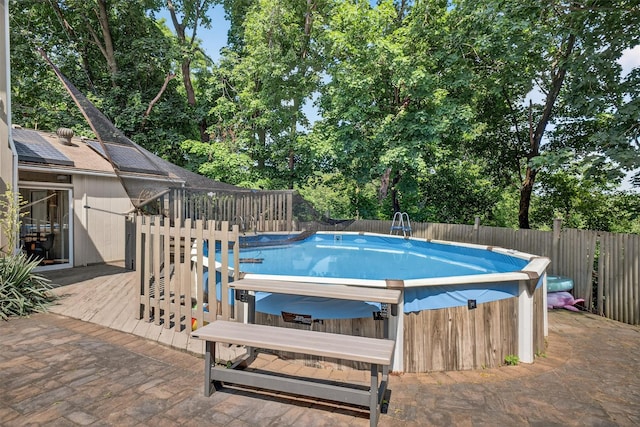 11 Beverly Ln, Peekskill, NY 10566 - view of pool with a fenced backyard, a jacuzzi, a wooden deck, and view of scattered trees