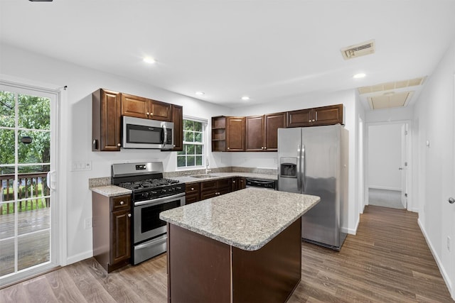 7 Jorge Ln, Wallkill, NY 12589 - kitchen featuring appliances with stainless steel finishes, wood finished floors, open shelves, a center island, and recessed lighting