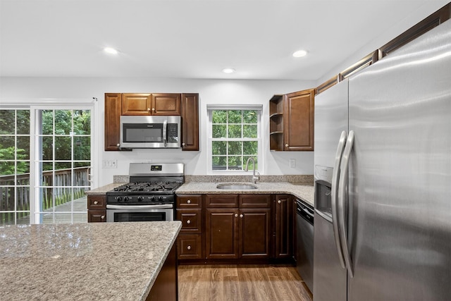 7 Jorge Ln, Wallkill, NY 12589 - kitchen with appliances with stainless steel finishes, light stone counters, light wood-type flooring, open shelves, and recessed lighting