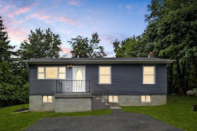 7 Jorge Ln, Wallkill, NY 12589 - view of front of house with a lawn and a chimney