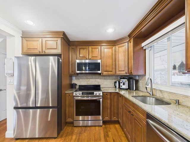 260 9th St, Bethpage, NY 11714 - kitchen featuring stainless steel appliances, light stone countertops, backsplash, dark wood finished floors, and recessed lighting